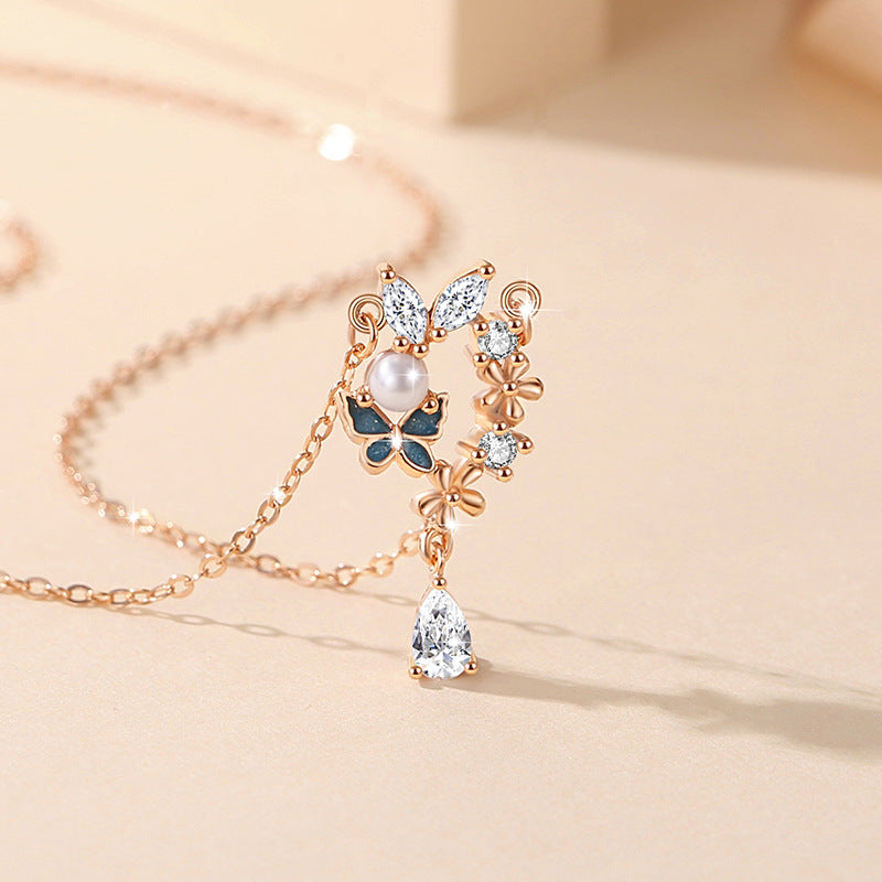 Sterling Silver Butterfly and Flower Necklace – Zircon Accents