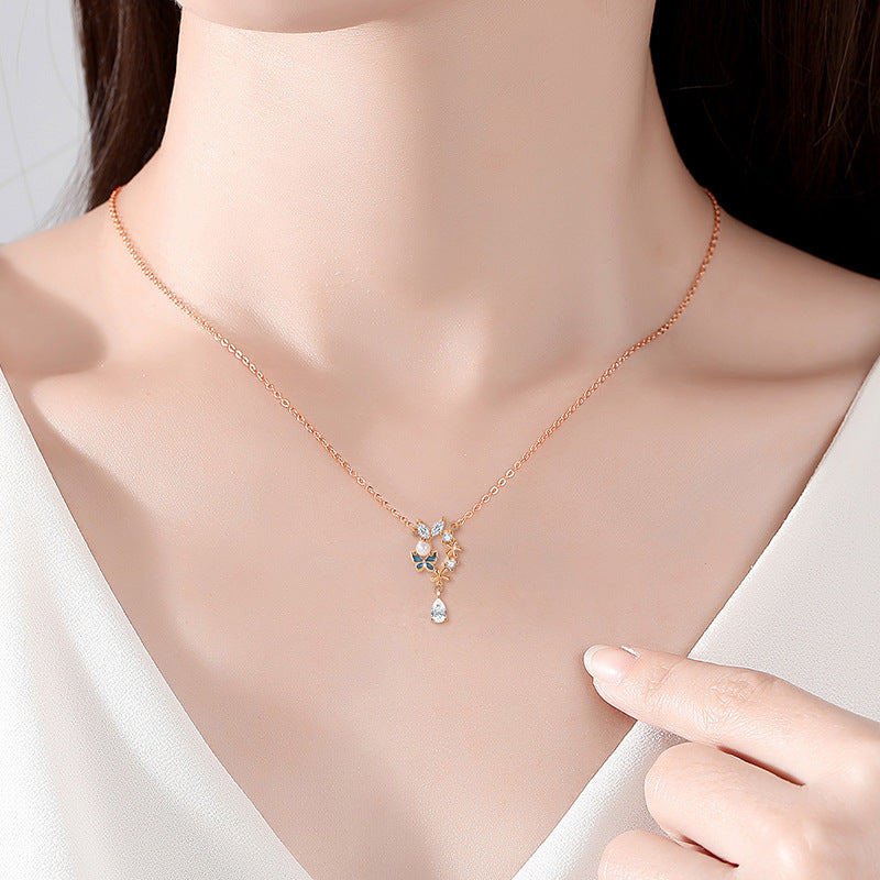 Sterling Silver Butterfly and Flower Necklace – Zircon Accents