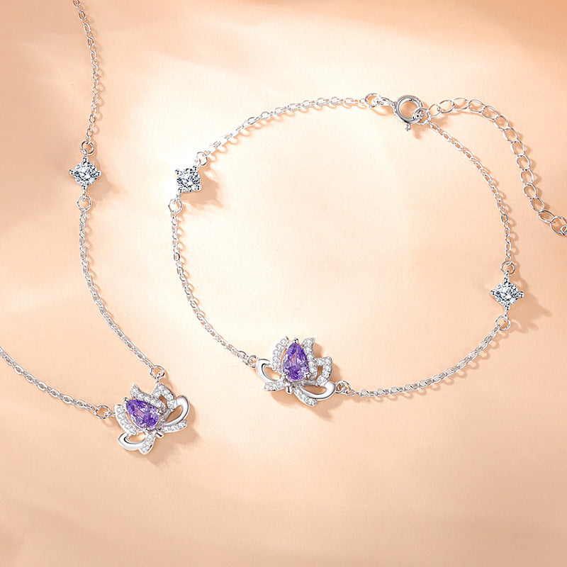 Sterling Silver Lotus and Bow Bracelet – Zircon Accents