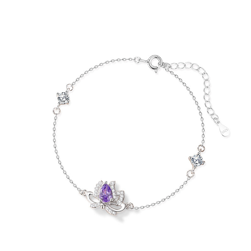 Sterling Silver Lotus and Bow Bracelet – Zircon Accents